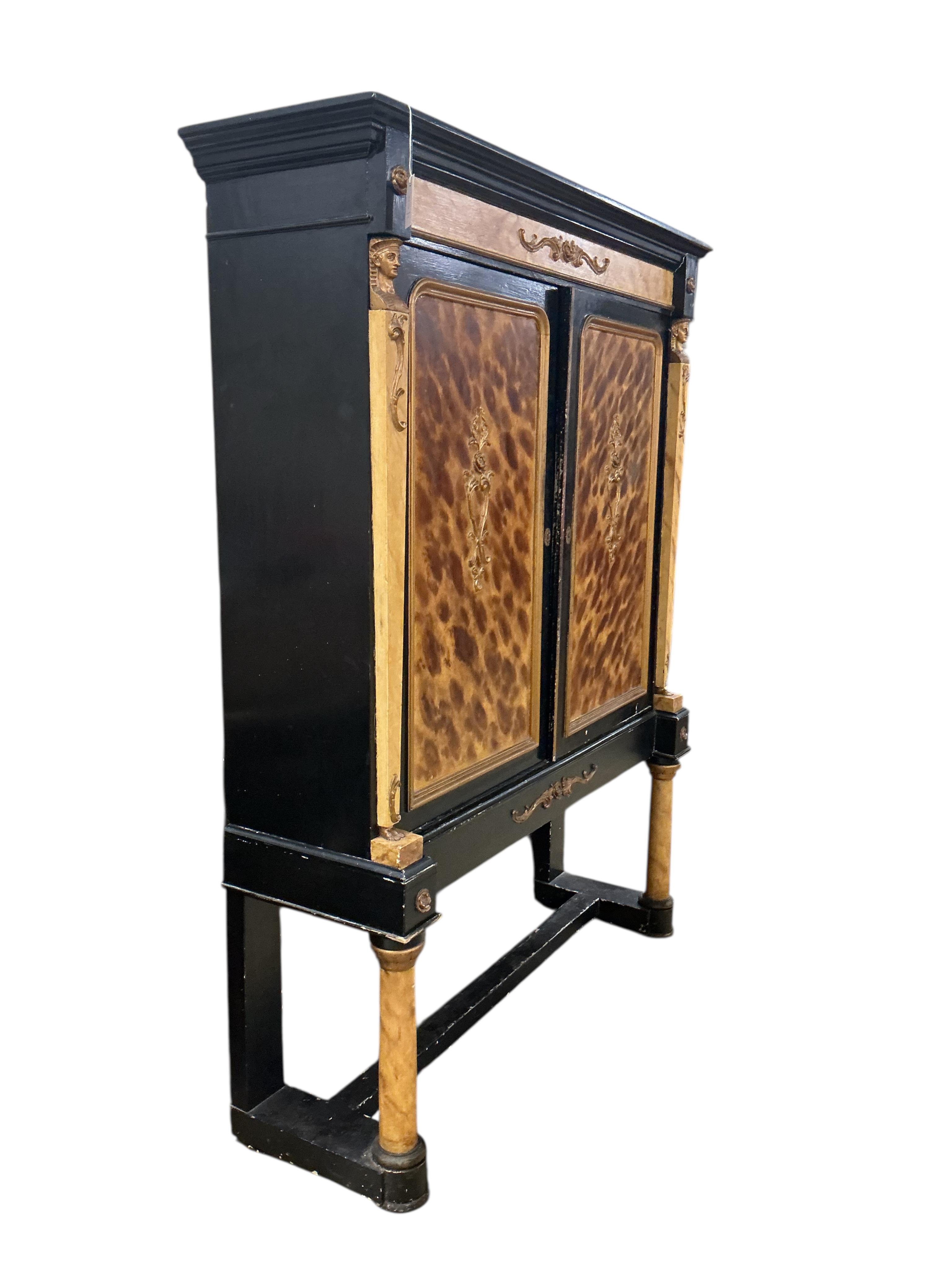 A painted Empire style faux marble two door cabinet on stand, width 140cm, depth 39cm, height 180cm